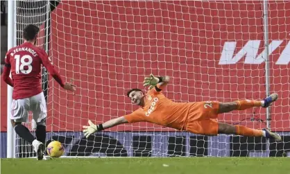  ??  ?? Bruno Fernandes scores from the penalty spot past Aston Villa’s Emiliano Martínez on New Year’s Day. The midfielder has scored 14 out of 15 spot kicks. Photograph: Lawrence Griffiths/AP