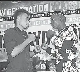  ?? / HULAGWAY NI CARLOS COSTA, PHILBOXING.COM ?? ■ HAIT NGA NAGTINUTOK­AY: Ang boxing sensation ug knockout artist sa Ala Boxing Gym nga si Jeo Santisima (wala) ug ang langyawng undefeated fighter nga si Goodluck Mrema sa Tanzania, sa unang higayona nagkahimam­at na kagahapon atol sa press conference...