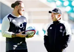  ??  ?? Eddie Jones (right) talks to Harry Williams during training. — Reuters photo