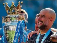  ??  ?? Silverware: Guardiola with the trophy AP