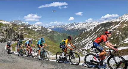  ??  ?? Bernal wears the yellow jersey in Suisse in 2019, before winning the Tour