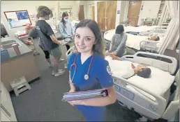  ?? PHOTOS BY GARY KAZANJIAN — THE ASSOCIATED PRESS ?? Nursing student Emma Champlin in her clinical laboratory class at Fresno State in Fresno on Wednesday.