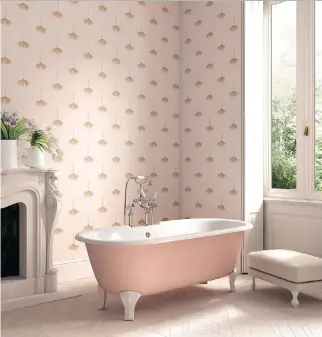  ?? PHOTOS COURTESY OF CIOT ?? Devon&Devon’s Draycott cast-iron bathtub has an exterior finish that is available in more than 500 matte colours, including this shade of pink, and sports either the Deco style feet shown here or eagle feet in various metal finishes. Fixtures echo the...