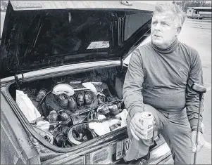  ?? WATERLOO REGIONAL RECORD/SUMBITTED PHOTO ?? Canadian golf legend Moe Norman leans on his car in this Oct. 14, 1986, file photo. His trunk was filled with golf equipment. P.E.I. concert promoter David Carver is working on a full-length feature film on the late golfer.