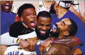  ?? DOUGLAS P. DEFELICE – GETTY IMAGES ?? LeBron James, middle, celebrates with his Los Angeles Lakers teammates after winning the 2020 NBA Championsh­ip on Sunday.