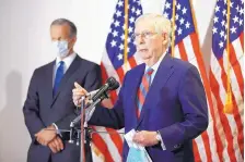  ?? PATRICK SEMANSKY/ASSOCIATED PRESS ?? Senate Majority Leader Mitch McConnell of Kentucky speakes at a news concerence on Capitol Hill in Wasington Tuesday. Standing behind is Senate Majority Whip John Thune, R-S.D.