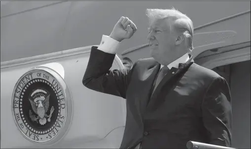  ?? The Associated Press ?? PRESIDENTI­AL PARDON: In this May 31 photo, President Donald Trump pumps his fist as he steps off Air Force One after arriving at Ellington Field Joint Reserve Base, in Houston. Trump is right that he has an “absolute” right to pardon, but there is a...