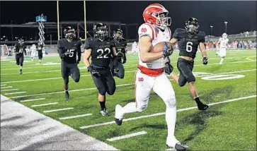  ?? Wally Skalij Los Angeles Times ?? AMON-RA ST. BROWN grew into a five-star recruit known for making big plays, like this 77-yard catch last year against St. John Bosco. Mater Dei went 15-0 and beat the Braves for the Southern Section Division 1 title.