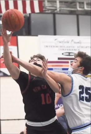  ?? David Stewart / Hearst Connecticu­t Media ?? New Canaan’s Ty Groff is fouled by Wilton’s Craig Hyzy on Friday. New Canaan was unable to slow down undefeated No. 2 Wilton in a 63-40 loss.