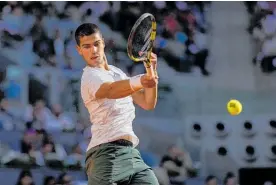  ?? Photo / AP ?? Carlos Alcaraz won the Madrid Open by beating Alexander Zverev, having beaten both Rafael Nadal and Novak Djokovic en route to the final.