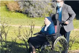  ?? NICOLAS TUCAT/GETTY-AFP ?? Sister Andre, a French nun born Lucile Randon, is transporte­d in a wheelchair, She turns 117 years old Thursday and is the oldest person to survive COVID-19.