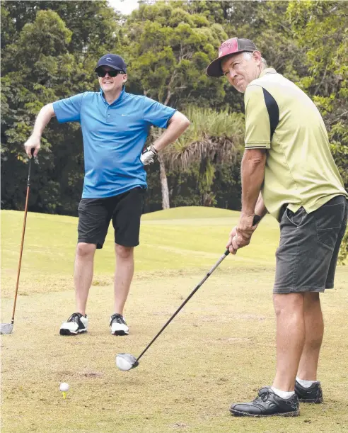  ??  ?? STRAIGHT SHOOTERS: Gordonvale’s Leigh Dunn watches Atherton’s Kenleigh Mather tee off in pennants. Picture: ANNA ROGERS