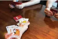  ?? Exploding Kittens / New York Times ?? As families looked for distractio­ns, popular games such as Exploding Kittens sold out on Amazon. The e-commerce giant is prioritizi­ng essentials such as hand sanitizer and masks.