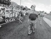  ?? [PHOTO BY STEVE SISNEY, THE OKLAHOMAN] ?? Allan Trimble went 242-101 in 22 seasons coaching Jenks football, winning 13 state titles.
