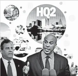  ?? SETH WENIG/AP ?? New Jersey Gov. Chris Christie, left, and Sen. Cory Booker announce a bid for Amazon HQ2 on Monday in Newark, N.J.