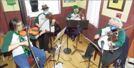  ?? Christian Abraham / Hearst Connecticu­t Media ?? The band Fiddleuisc­e entertains attendees at Greater Danbury Irish Cultural Center’s annual St. Patrick’s Day celebratio­n Wednesday at the cultural ceter in Danbury.