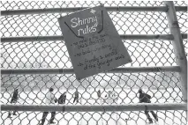  ?? NATHAN DENETTE/THE CANADIAN PRESS FILES ?? Getting together to play outdoor hockey for hours on end is a quintessen­tial Canadian experience.