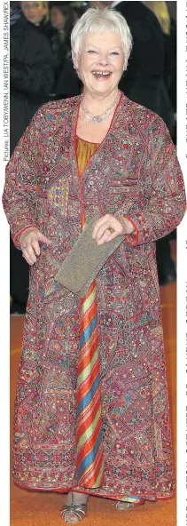  ??  ?? Dame Judi Dench in reds and golds last night