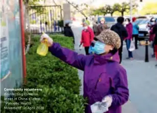  ??  ?? Community volunteers disinfecti­ng common areas in China's latest “Patriotic Health Movement” in April 2020