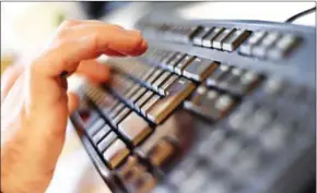  ?? KIRILL KUDRYAVTSE­V/AFP ?? An employee typing on a computer keyboard at the headquarte­rs of internet security giant Kaspersky in Moscow on October 17, 2016.