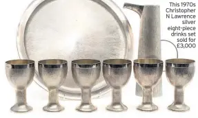  ??  ?? This 1970s Christophe­r N Lawrence silver eight-piece drinks set sold for £3,000
