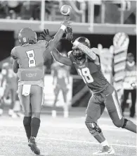  ?? MIKE CAUDILL/FREELANCE ?? Norfolk State defensive lineman De’Shaan Dixon tries to bat down a pass from Elizabeth City State’s Kevin Caldwell in September. Dixon has signed with the Jacksonvil­le Jaguars as an undrafted free agent.