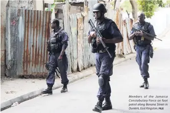  ?? FILE ?? Members of the Jamaica Constabula­ry Force on foot patrol along Banana Street in Dunkirk, East Kingston.