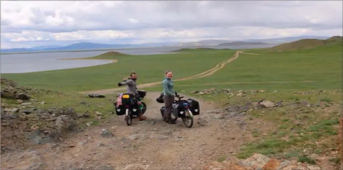  ??  ?? Ciaran Hussey and Laura McMorrow, curators of the second annual Leitrim Cycling Festival which takes place across the weekend of June 22nd to 24th. The couple are pictured on the barren planes of Mongolia during their five month marathon cycle from the Japanese coastal town of Kanazawa, back home to the west of Ireland. Photo: Ciaran Hussey.