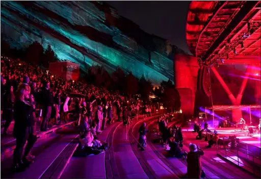  ?? DENVER POST FILE ?? Music fans enjoy the band Lotus at Red Rocks Park and Amphitheat­re on April 22, 2021.