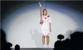  ?? Photo / AP ?? Naomi Osaka says lighting the Olympic flame is “undoubtedl­y the greatest athletic achievemen­t and honour I will ever have in my life”.