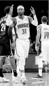  ?? ABBIE PARR/GETTY IMAGES ?? Orlando’s Terrence Ross reacts in frustratio­n after the Magic's 126-121 loss against the Brooklyn Nets on Friday.