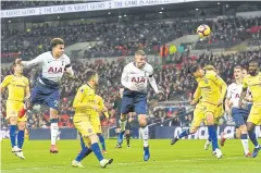  ?? EPA ?? Tottenham’s Dele Alli, second left, scores his team’s opening goal with a header.