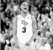  ?? JOHN RAOUX/ASSOCIATED PRESS ?? UCF’s A.J. Davis celebrates after making a 3-pointer against Wichita State to force overtime last week.