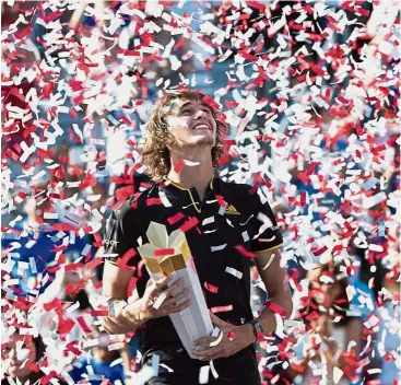  ?? — AP ?? Celebratio­n time: Confetti falling on Alexander Zverev during his victory ceremony at the Rogers Cup on Sunday.