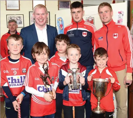  ??  ?? CBS Primary School Principal Michael O’Sullivan with Cork All-Star Darragh Fitzgibbon and Charlevill­e Captain Danny O’Flynn and pupils of the school when the team visited the school last week.