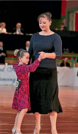  ??  ?? Alison McDermott dancing with her daughter Amelia at the nationals.
