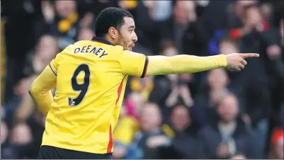  ?? DARREN STAPLES / REUTERS ?? Troy Deeney celebrates netting his third goal in four matches to help Watford to a 2-1 victory at home to Burnley on Saturday. The striker has been in fine form for the Hornets, with seven goals in the EPL so far this season.