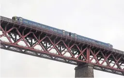  ?? Picture: Wullie Marr Photograph­y ?? This train was held on the bridge for two hours due to the chaos.