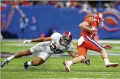  ?? BUTCH DILL / AP ?? Alabama’s Minkah Fitzpatric­k lunges for Clemson’s Hunter Renfrow in a semifinal in January. The teams will meet for this season’s title, writes Ralph D. Russo.