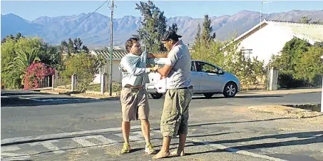  ??  ?? LONG ARM OF THE LAW: Graham Hunter, left, tangles with the BMW driver