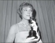  ?? ANONYMOUS ?? FILE - This April 6, 1965file photo shows actress Julie Andrews holding her best actress Oscar for “Mary Poppins” in Santa Monica, Calif. Andrews released a memoir, “Home Work: A Memoir of My Hollywood Years,” which hits shelves on Oct. 15, 2019.