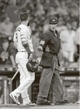  ?? Karen Warren / Houston Chronicle ?? The Astros’ Marwin Gonzalez, who made the game’s final out on a called third strike, also tries to get in the final word with plate umpire Paul Nauert.
