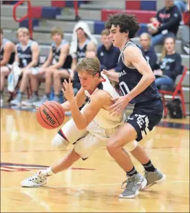  ?? / Danielle Pickett ?? Heritage’s Will Allen crashes into Gordon Lee’s Wiley Heming during a game at Heritage earlier this season. Whitsett on his way to the basket during the season-opener in Boynton on Nov. 15. Heritage’s Nolan Letzgus drives past Gordon Lee’s Timothy