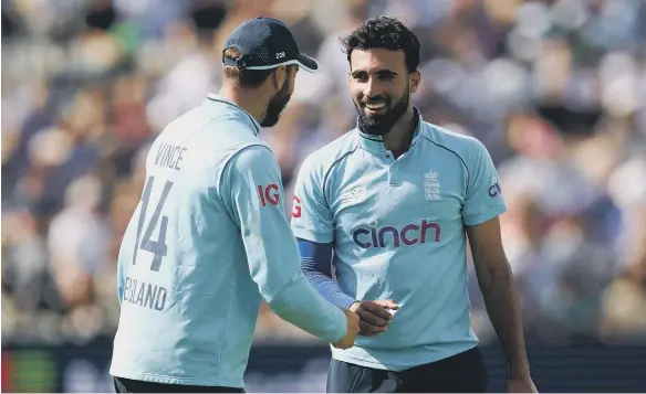  ??  ?? England’s Saqib Mahmood (right) celebrates the wicket of Shadab Khan with team-mate James Vince during the third one day internatio­nal match at Edgbaston.