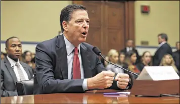  ?? PABLO MARTINEZ MONSIVAIS / ASSOCIATED PRESS ?? FBI Director James Comey testifies in Washington in September. Documents show the FBI sought a search warrant for Hillary Clinton’s emails in part for evidence of “intrusions” by those seeking to steal classified informatio­n.