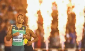  ?? Glyn Kirk / AFP / Getty Images ?? South Africa’s Wayde van Niekerk breezes to a win in the injury-thinned final of the men’s 400 meters at the world championsh­ips in London.