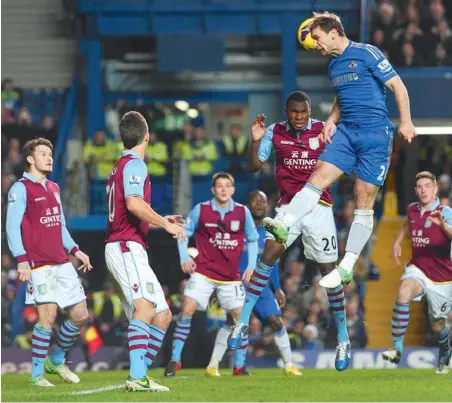  ??  ?? Chelsea’s Serbian defender Branislav Ivanovic (right) heads the ball during their English Premier League match against Aston Villa at Stamford Bridge in London on Sunday. Chelsea won 8-0.