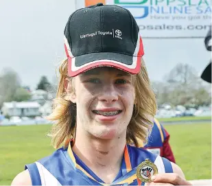  ??  ?? Warragul Industrial­s player Tyler Irving capped a successful season with the medal for best on ground in the under 16 grand final; Photograph­s: Michael Robinson.