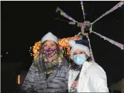  ?? Mona Weatherly ?? Above, at the Polar Express wheel for Nebraska State Bank are Tammy Schall, left, and Betsy Smith.