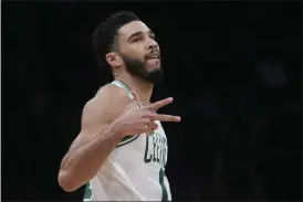  ?? CHARLES KRUPA — THE ASSOCIATED PRESS ?? The Celtics’ Jayson Tatum celebrates after hitting a 3-pointer against the Trail Blazers on Wednesday at TD Garden in Boston.